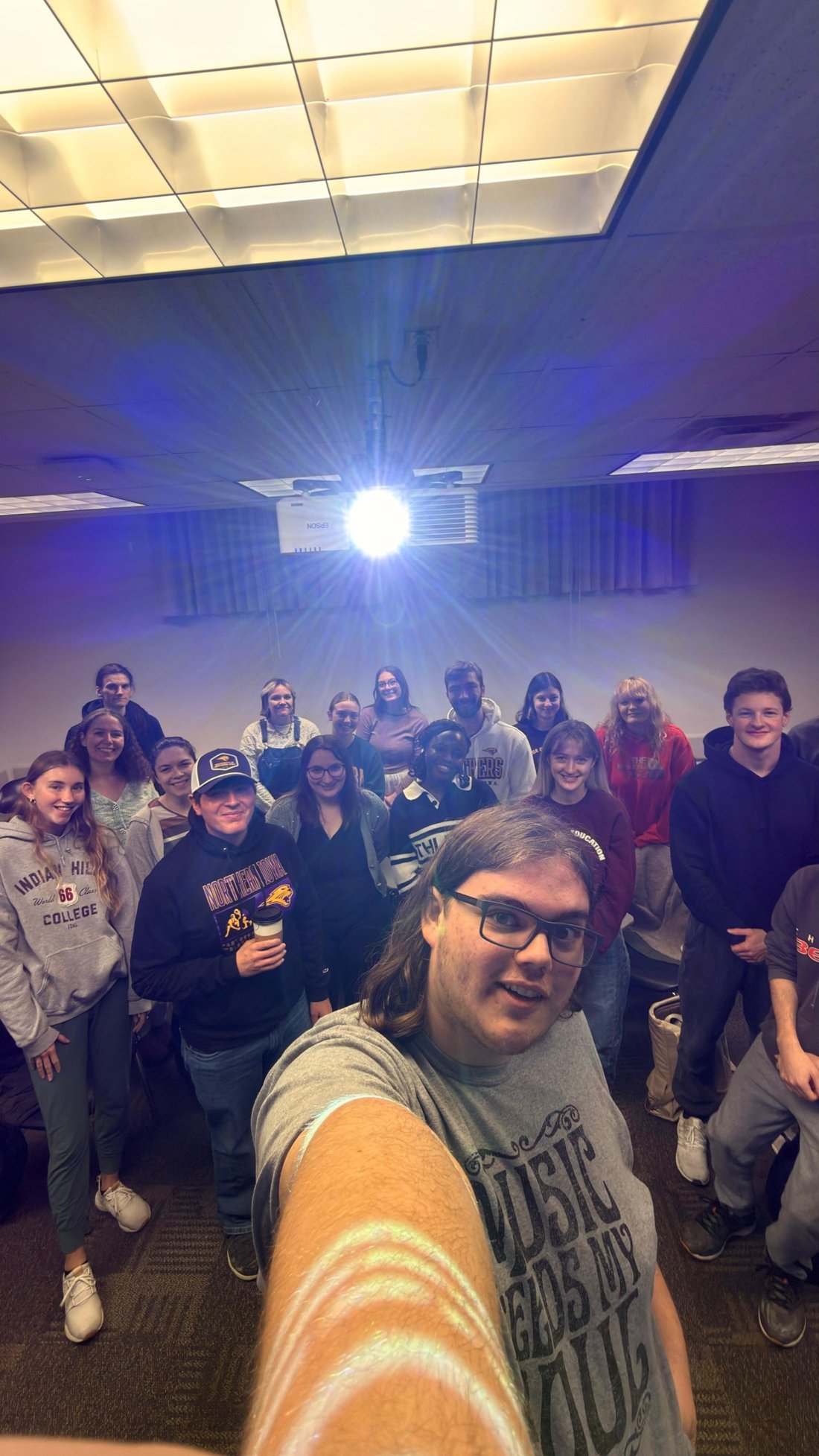 A full class gathered for a group selfie