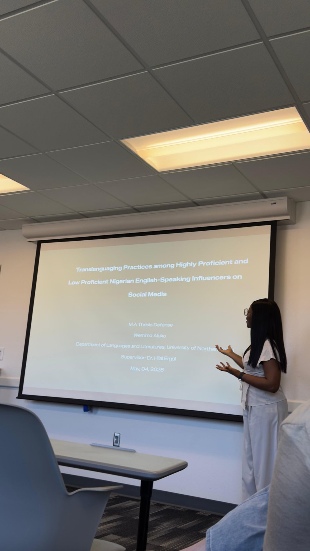 Wemimo presenting her M.A. thesis defense slides